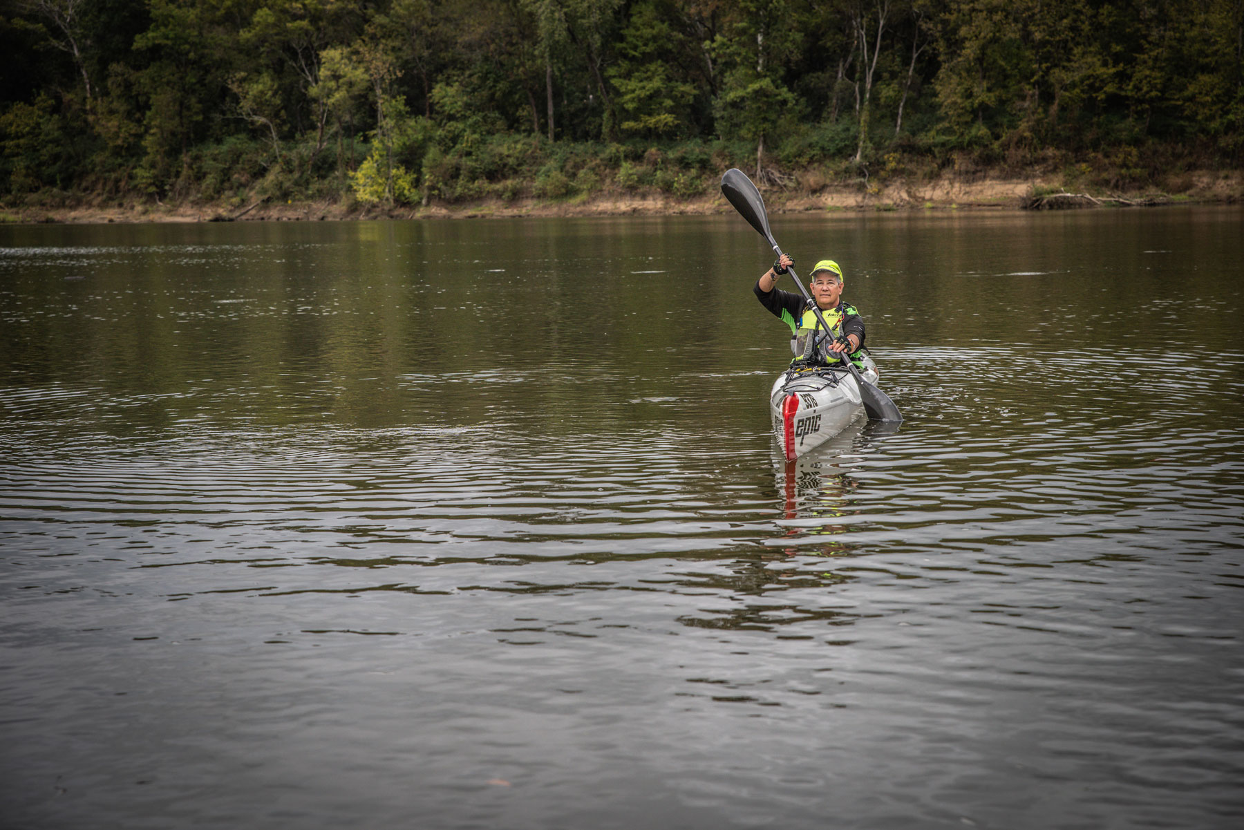 A woman kayaking on the water.