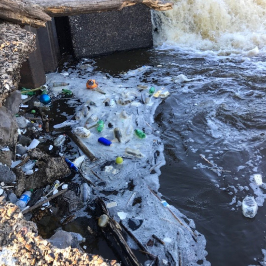 Trash from land sources collecting below the Ross Barnett spillway to the Pearl River, near Jackson. Photo by Abby Braman, Pearl Riverkeeper.