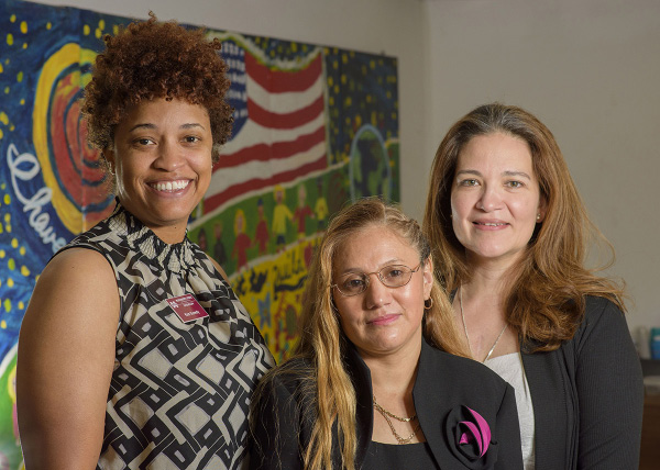 An Extension agent with two of her Hispanic clients.