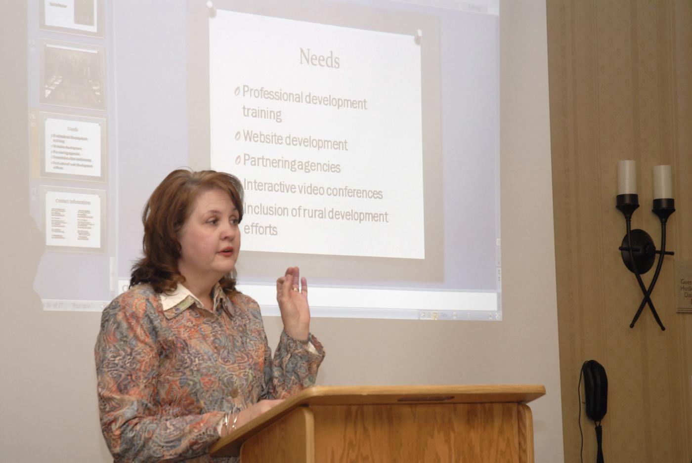 Karen Benson, family and child development area agent with Mississippi State University's Extension Service, reviews some needs related to poverty issues. Government agencies, community leaders and religious groups recently met in Neshoba County to advance the Strengthening Families and Communities Coalition. (Photo by MSU Ag Communications/Linda Breazeale)