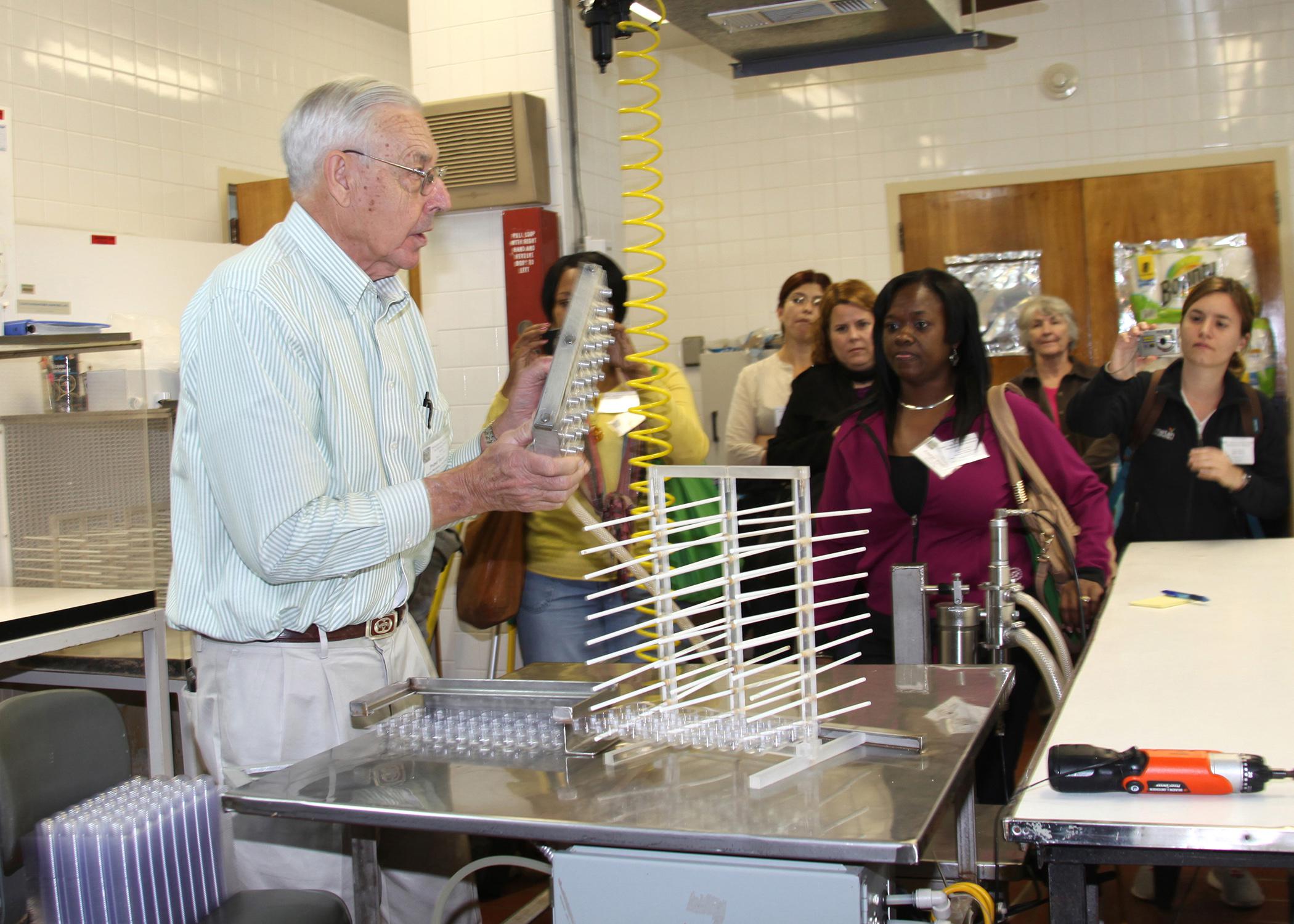 Frank Davis, founder and coordinator of the Insect Rearing Workshop at Mississippi State University, leads a tour of the USDA Agricultural Research Service lab Nov. 5, 2013. The 16th annual Insect Rearing Workshop featured sessions on raising insects for protein. (Photo by MSU Ag Communications/Kat Lawrence)