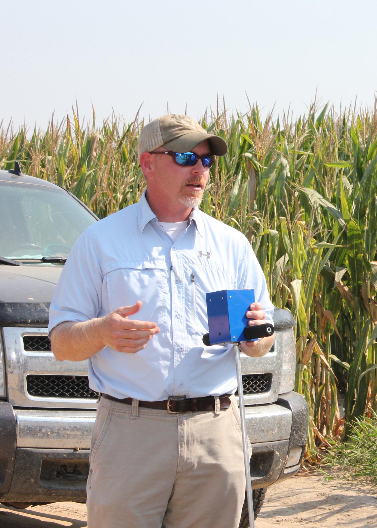 Jason Krutz, an irrigation specialist with Mississippi State University, holds a portable soil moisture meter, one of the tools needed to help producers make irrigation decisions with scientific accuracy. (Photo by MSU Ag Communications/Bonnie Coblentz)