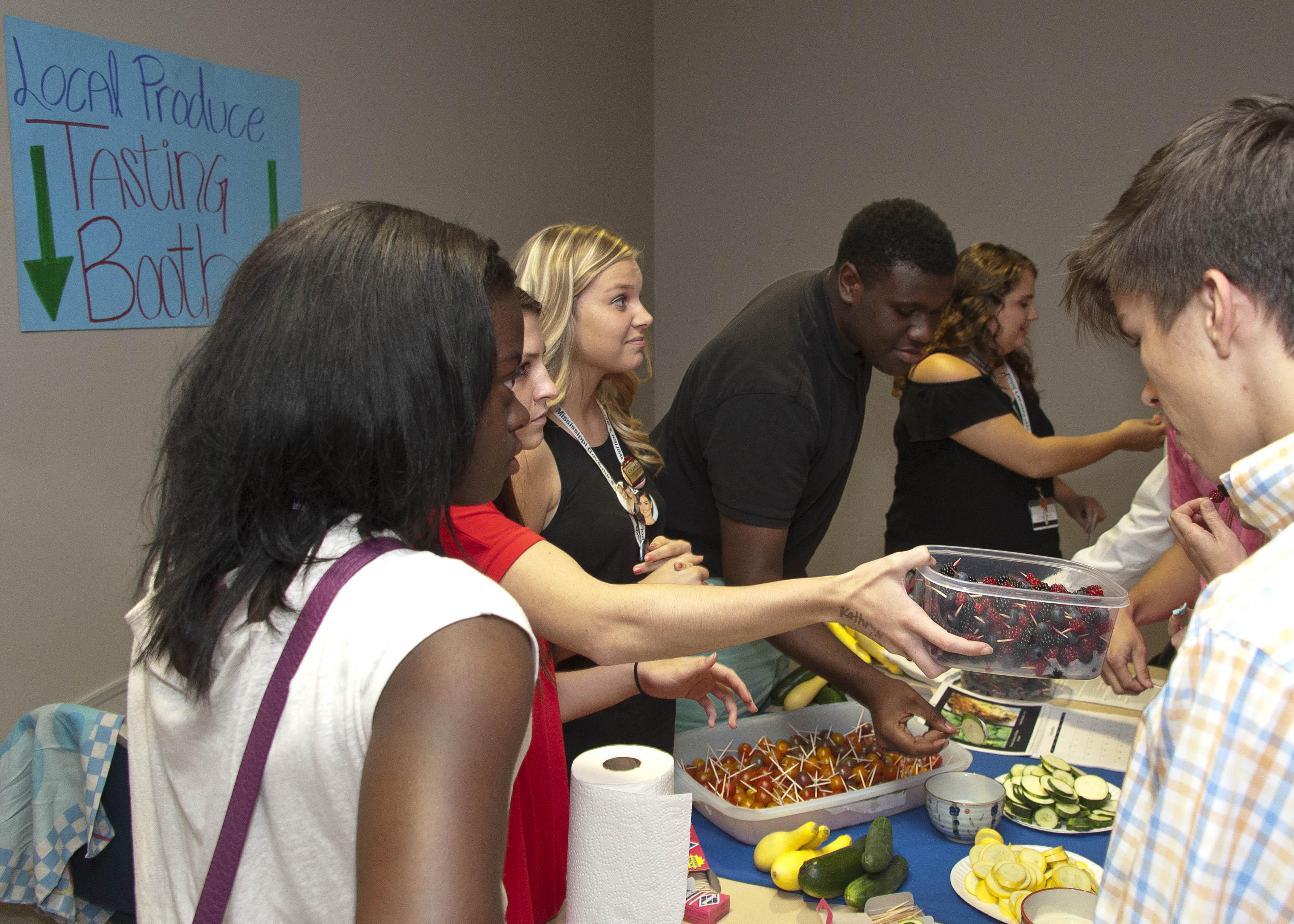 Students at the Mississippi Governor's School sample local produce after a presentation on agritourism on June 18, 2014. The Mississippi Governor's School partnered with the Mississippi State University Center for the Advancement of Service-Learning Excellence to promote service-learning and agriculture. (Photo by MSU Ag Communications/Kevin Hudson)