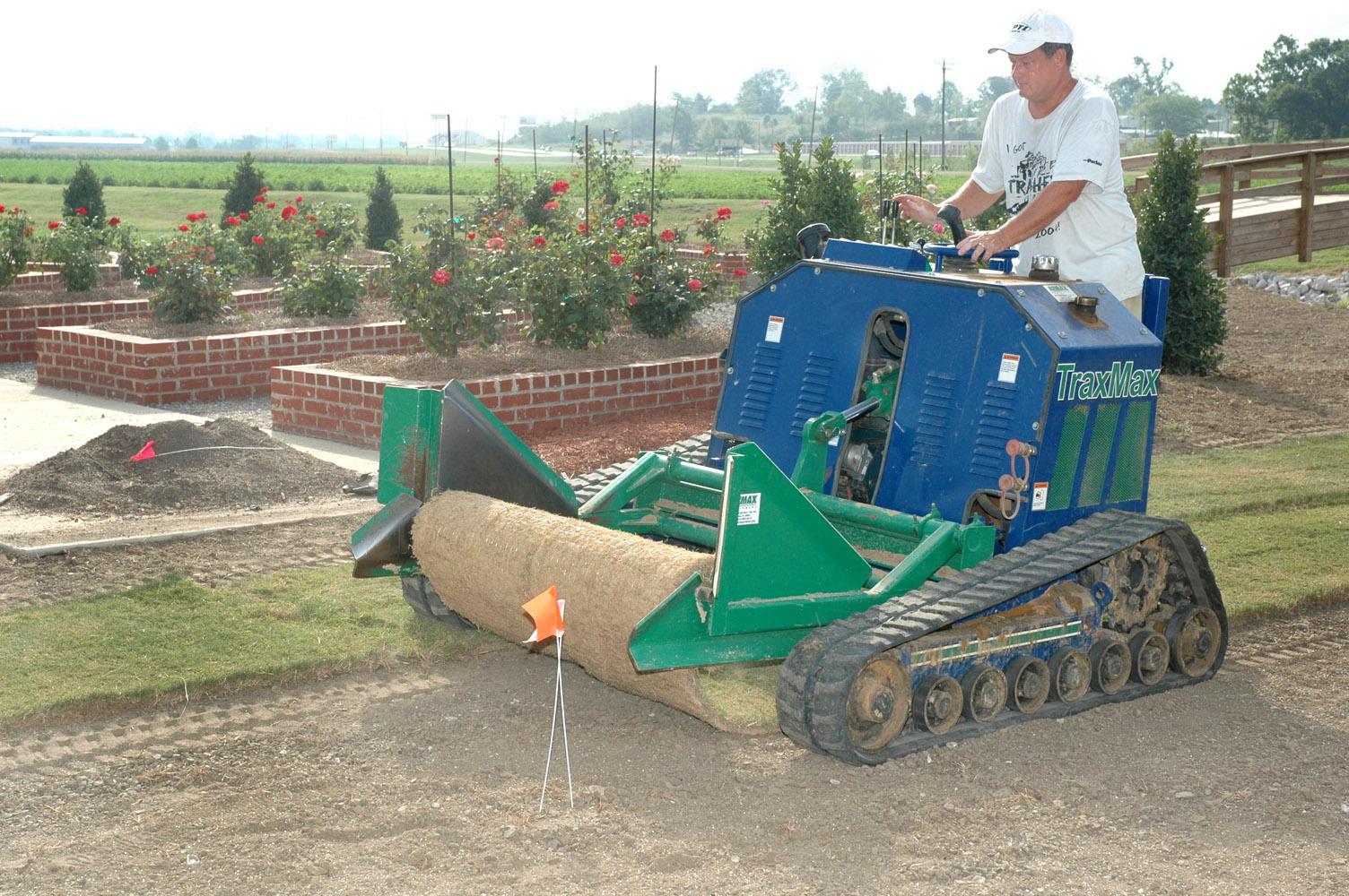 Barry Stewart, associate professor of plant and soil sciences at Mississippi State University, uses a sod installer to roll out Mississippi Pride turf near the new rose garden at the R.R. Foil Plant Science Research Center on the MSU North Farm. Mississippi Pride, which is known for its color, density and durability, is one of several popular grasses developed by MSU researchers.