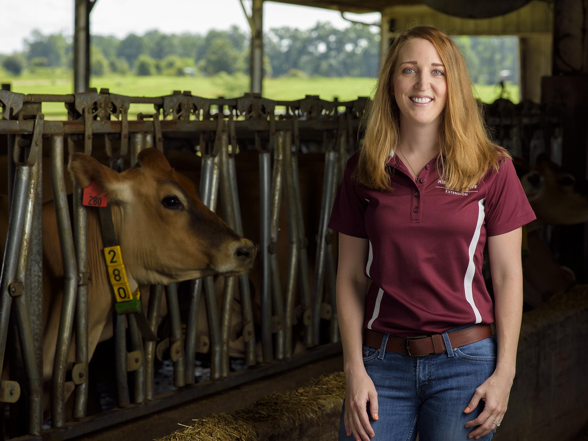 Amanda Stone, dairy specialist with the Mississippi State University Extension Service, studies the herd at the MSU Bearden Dairy Unit and brings the latest research-based information to the state’s dairy producers. (Photo by MSU Extension Service/Kevin Hudson)