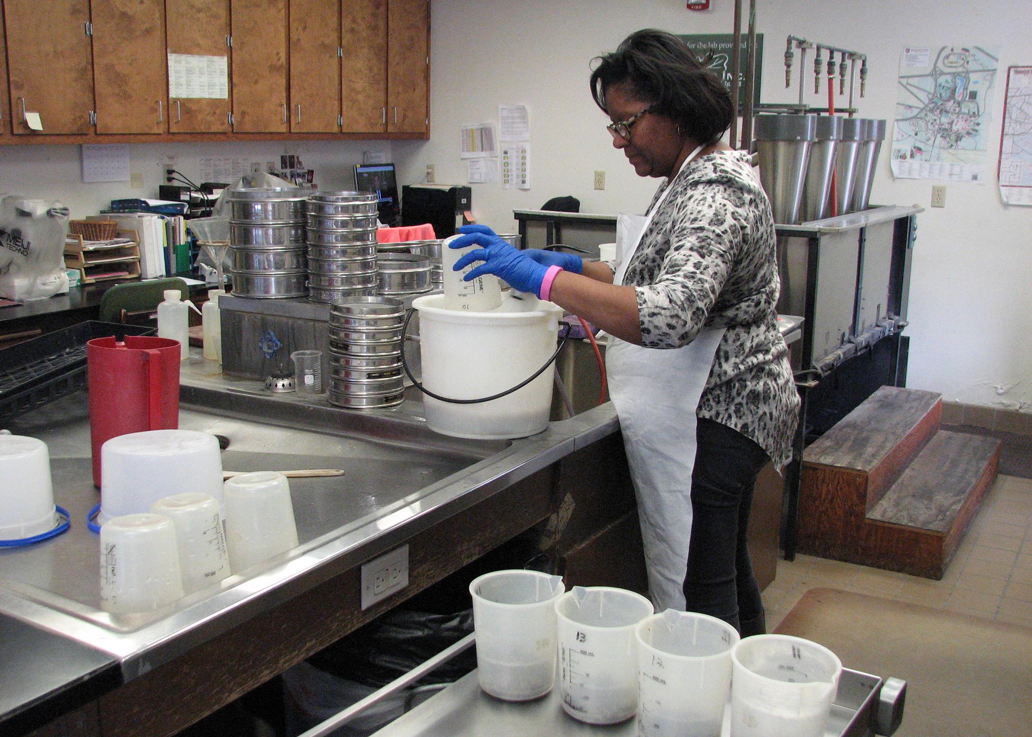 A woman works in a laboratory.