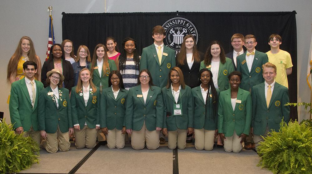 Large group of 4H'ers on stage.