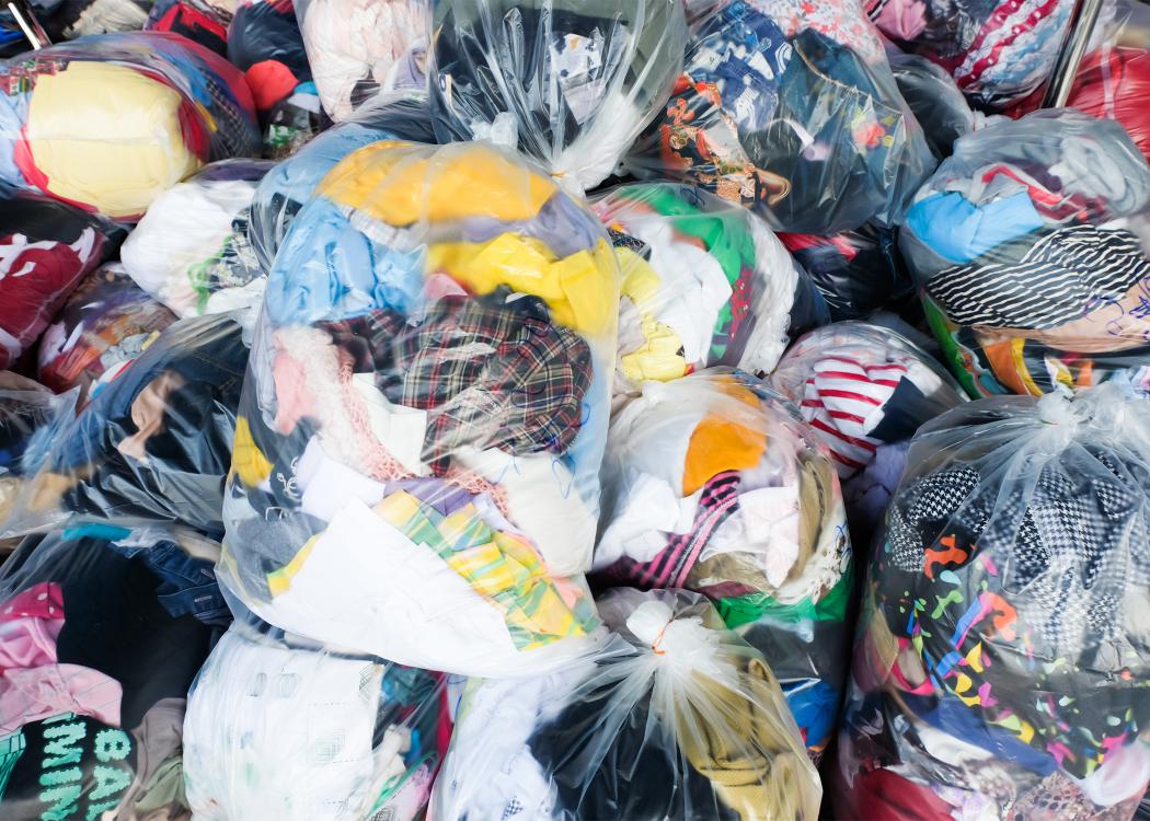 Bags are filled with used clothing.