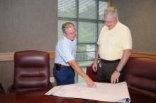 Gary Lawrence and Roger King of Mississippi State University analyze a map showing nematode sample locations and reflectance data to determine areas of high nematode populations. (Photos by Kat Lawrence)