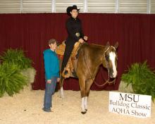 Brooke Ware of Brandon was the amateur all-around high-point winner at the Mississippi State University Bulldog Classic AQHA show. She is pictured with coach Shon Ghee of McBeath Quarter Horses.