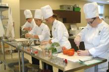 Andrew Simons, Brianna Allen, Shelby Harris and Jessica Wasmer, members of the St. Martin High School 4-H Club, prepare Gulf Coast Bouillabaisse ingredients during a practice run for the 2012 Great American Seafood Cook Off held Aug. 12 in New Orleans. (Photo by MSU Ag Communications/Susan Collins-Smith)