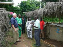 Mississippi State University veterinarian Dr. Skip Jack (left) toured a Fisheries Research Farm hatchery in Ibadan, Nigeria. Dr. Bamidele O. Omitoyial of the Department of Aquaculture and Fisheries Management speaks while Dr. Gbenga Idowo of the Christian Veterinarians Nigeria (second from left) and Dr. Tayo Babalobi of the University of Ibadan Veterinary School (in white) and two student workers listen. (Submitted Photo)