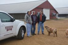 Okolona poultry grower Joe Ellis, left, discusses issues related to his farm with Mississippi State University poultry scientists Tom Tabler, center, and Morgan Farnell on March 6, 2014. (Photo by MSU Ag Communications/Linda Breazeale)