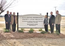 The Mississippi State University Brown Loam Branch Experiment Station was renamed in honor of E.G. "Gene" Morrison on Nov. 20, 2014, who served as its superintendent for 33 years. Morrison, third from left, is pictured with the new sign along with Mississippi Senator Perry Lee, far left; Mississippi Agricultural and Forestry Experiment Station director George Hopper; Central Mississippi Research and Extension Center Head Sherry Surrette; Vice President for the Division of Agriculture, Forestry and Veterinar