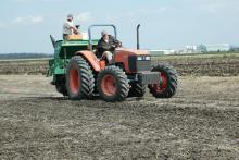 Scott Lanford and Sanfrid Shaifer planted rice March 7 at Mississippi State University's Delta Research and Extension Center in Stoneville. (Photo by Rebekah Ray)