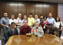 Cochran fellows from Tajikistan presented gifts to hosts from Mississippi State University before returning home. Standing, from left, are Farkhodzhon Soliev, Naim Rashidov, Zaynulo Madzhitov, Mokhsin Tolibov, Akmaljon Nasrulloev, Abdullo Shodiev, MSU graduate student Madhur Devkota, Gulnoz Hisamutdinova, Khurshed Rakhimov, and MSU graduate student Xiaojing Ni. Seated, from left, are Prem Parajuli, program training coordinator; Gregory Bohach, vice president for the MSU Division of Agriculture, Forestry and