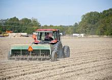 Wheat acreage is expected to be up from last year, but the ground across most of the state was too dry to plant through October. Blake Garrard is shown planting wheat last fall at the Mississippi State University Rodney Foil Plant Science Research Center in Starkville. (File photo by MSU Extension/Kat Lawrence)