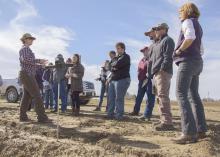 Rachel Stout Evans, a soil scientist with the Natural Resources Conservation Service, speaks to Mississippi State University Extension agents at a row crop farm in Shaw, Mississippi.