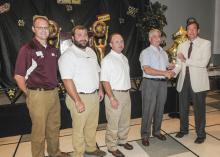 Regions Bank representatives, from left, Brad Jones, Walt Stephens and Alan Sims join Mississippi State University forest products professor Phillip Steele as he accepts the Superior Faculty Award for research from Greg Bohach, vice president for the Division of Agriculture, Forestry and Veterinary Medicine on Aug. 2. Regions Bank pledged $50,000 over five years to fund DAFVM awards for exceptional merit in five areas: teaching, research, Extension and outreach, service, and international collaboration. (Ph