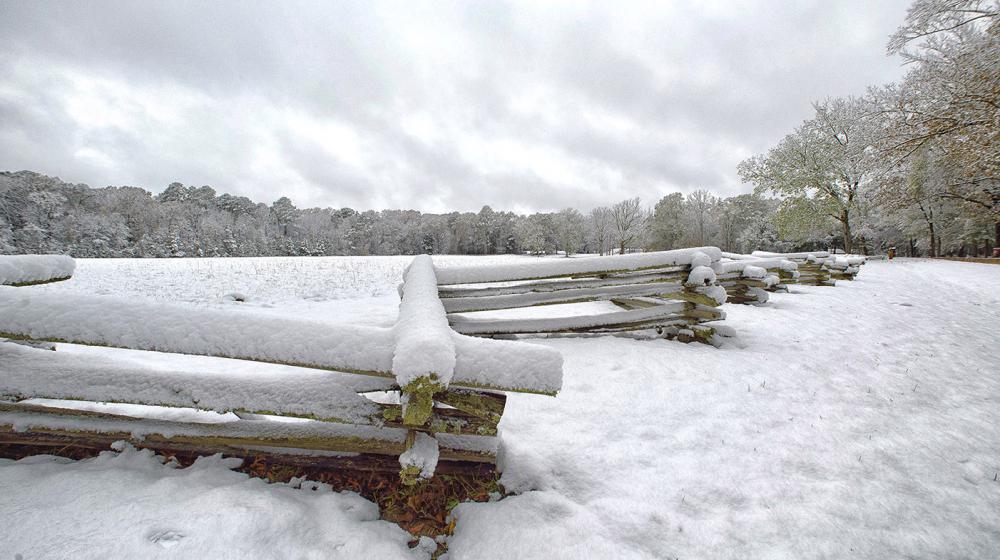 Snow covers a split-rail fence near Mount Locust on the Natchez Trace in Jefferson County, Mississippi on Dec. 8, 2017. Photo credit: Kevin Hudson Snow covers a split-rail fence and trees near Mount Locust on the Natchez Trace in Jefferson County, Mississippi on Dec. 8, 2017.