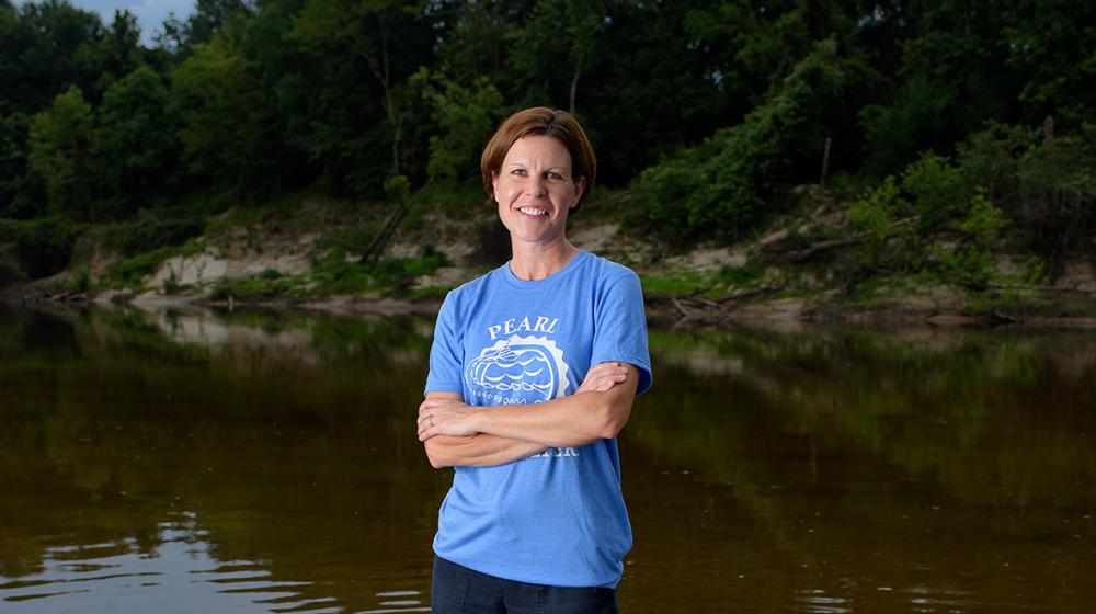 Abby Braman standing in a creek.