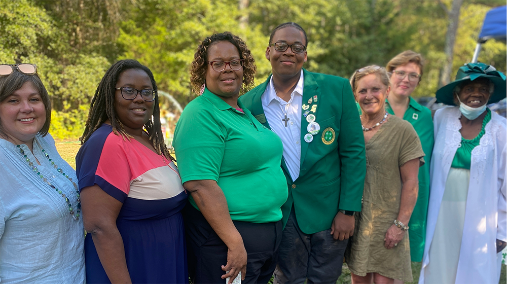  Group of people standing in line celebrating 4-H Sunday.