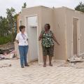 Mae Gladys Dotson, right, shows Choctaw County Extension director Juli Hughes where she sought shelter when the April 24 tornado destroyed her home. (Photo by Scott Corey)