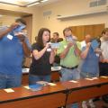 Participants in a recent Harvest from Open Waters training in Biloxi line up to sniff samples of shrimp and grouper spiked with oil in concentrations as low as 5 parts per million and less. (Photo by Karen Templeton)