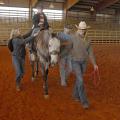 Garrett Sullivan, 10, of Laurel, enjoys a ride on Reno at the Lamar County Fairgrounds in Purvis. Turners and Burners 4-H Club volunteer leader Lona Booth, leading the horse, is assisted by side-walkers Kaitlyn Barber and Ross Mills during the Sweetheart Rodeo on March 16, 2013. (Photo by MSU Ag Communications/Linda Breazeale)