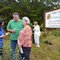 Jason McDonald (center), FiLoLi Tea Farm owner, talks with Guihong Bi (left), associate research and Extension Professor with Mississippi State University and Shirley Estes, Lincoln County Master Gardener, after the Oct. 17 groundbreaking for the first-ever commercial tea-growing operation in Mississippi. (Photo by MSU Ag Communications/Susan Collins-Smith)