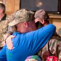 Wanda Hall of Mt. Olive hugs Paul O'Neill of Memphis, Tennessee, a veteran of the U.S. Army's 3rd Stryker Brigade on Dec. 12, 2014, in appreciation for his military service. O'Neill is one of nine soldiers who participated in the Hot Coffee Hunts for Heroes and received quilts from the Mississippi Homemaker Volunteers of Covington County. (Photo by Robert Lewis)