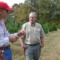 Christmas tree producer Don Kazery Jr., left, discusses agricultural practices on his Hinds County farm with Stephen Dicke, a forestry professor with the Mississippi State University Extension Service, on Nov. 6, 2014. Harsh weather conditions in 2014 and several years of high demand reduced the number of trees available in heavily populated counties. (Photo by MSU Ag Communications/Susan Collins-Smith)