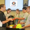 Ryan Akers (left), an assistant Extension professor in the Mississippi State University School of Human Sciences, helps 4-H members examine items in a disaster preparedness backpack. Madison Crawford (second from left) and Leigh Anne Walley, both of Greene County, joined Caleb Walley and Bo Henderson, both of Wayne County, in the workshop on June 1 at the 2017 State 4-H Congress in Starkville, Mississippi. (Photo by MSU Extension Service/Linda Breazeale)