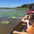 Simply taking children outside will open their eyes and hearts to the outdoors. While canoeing with adults on Bluff Lake in Noxubee County, Mississippi, this child searched for alligators and birds with her binoculars. (Photo by MSU Extension Service/Evan O’Donnell)