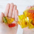 Closeup of gummy vitamins in a child’s hand