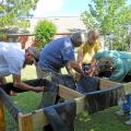 From left, Lamar County Extension Agent Ross Sadler, Pine Belt Master Gardener Paul Cavanaugh, Lamar County Technical Center teacher and volunteer Ken McCoy and Pine Belt Master Gardener intern Cecil Chambliss prepare a handicapped-accessible raised bed for plants. The group built two beds for residents of The Windham House of Hattiesburg, an assisted-living facility for seniors on May 28 and will return monthly to help with the beds and teach workshops. (Photo by MSU Ag Communications/Susan Collins-Smith)