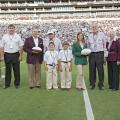 Fans celebrated a win and 4-H Youth Development Saturday, Sept. 21, 2013, at Mississippi State University’s football game against Troy University. From left are Greg Bohach, vice president for the MSU Division of Agriculture, Forestry and Veterinary Medicine; Gary Jackson, director of the MSU Extension Service; MSU President Mark Keenum; Rep. Preston Sullivan with grandsons Lake and Tyler; State 4-H President Mary Kate Gaines of Coldwater; Sen. Billy Hudson and his wife, Barbara; and Paula Threadgill, Exten