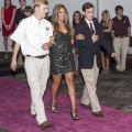 Mississippi State University junior Ashley Rowland of Gulfport, escorted by Justin Lofton of Bentonville, Ark., left, and John Dergin May of Madison, models a Milly gown at the Rent the Runway fashion show on Oct. 16, 2013. The event was sponsored by Fashion Focus, the campus service club for students interested in apparel, textiles and merchandising careers. (Photo by MSU Ag Communications/Scott Corey)