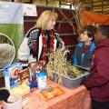 Lisa Stewart, an agent with the Mississippi State University Extension Service in Webster County, explains the importance of rice to Clayton Griffin and Jalen Washington, third-graders from Houston Upper Elementary School, at the FARMtastic event at the Mississippi Horse Park near Starkville on Nov. 13, 2014. (Photo by MSU Ag Communications/Kevin Hudson)
