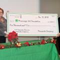 Monsanto Co. representative Derenda Stanley, left, presents Susan Holder a ceremonial check for $5,000 in support of 4-H. Holder, director of the 4-H Youth Program with the Mississippi State University Extension Service, said the funds will support the 4-H Cooperative Business Leadership Conference in 2011. This annual event is the reward given to senior-level 4-H members who placed first in their state competitions at 4-H Congress and state 4-H leadership team members. The primary objective of grants from 