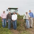 A two-row digger shaker donated to the Mississippi Peanut Growers Association by Kelley Manufacturing Company was demonstrated recently at Parrish Farms in Holmes County. On hand for the demonstration were, from left, Brad Burgess, Mississippi State University’s variety testing director; Malcolm Broome, Mississippi Peanut Growers Association executive director; Keith Weeks, KMC territory manager; Daniel Parrish, MPGA board member; and Reuben Moore, Mississippi Agricultural and Forestry Experiment Station as