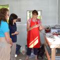 Donna Beliech, horticulture agent with the Mississippi State University Extension Service; Judson Lecompte, MSU research associate, and Guihong Bi, MSU associate research professor, listen as tea blender Beverly Wainwright explains the process of developing tea blends at The Great Mississippi Tea Company in Brookhaven, Mississippi, on Oct. 2, 2015. Wainwright is working with other tea consultants to make unique tea blends for the company. (Photo by MSU Ag Communications/Susan Collins-Smith)