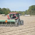 Wheat acreage is expected to be up from last year, but the ground across most of the state was too dry to plant through October. Blake Garrard is shown planting wheat last fall at the Mississippi State University Rodney Foil Plant Science Research Center in Starkville. (File photo by MSU Extension/Kat Lawrence)