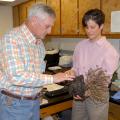 Lynn McMahan of Vancleave, past president of the Mississippi Master Gardeners, learns about plant diseases from Clarissa Balbalian, manager of the Mississippi State University Extension Service's plant diagnostic lab, during campus tours in 2013. (File photo by MSU Ag Communications/Linda Breazeale)