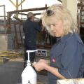 Dr. Linda Farris of the Animal Health Center in Brookhaven examines an artificial insemination rod during a Mississippi State University reproduction workshop for cattle producers on March 15, 2013. (File photo by MSU Ag Communications/Linda Breazeale)