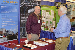 Two men in discussion at a business development workshop.